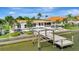 Waterfront home with a private dock, boat lift, pool, and spacious patio area perfect for outdoor entertaining at 1901 Kansas Ne Ave, St Petersburg, FL 33703