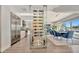 Open concept living with modern wine rack feature, dining area, and chef's kitchen at 1901 Kansas Ne Ave, St Petersburg, FL 33703