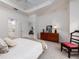 Bright bedroom with a view to the en-suite bathroom and a spacious living area at 19137 Lake Audubon Dr, Tampa, FL 33647