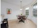 Bright breakfast nook features a round table and a large window overlooking the outdoors at 19137 Lake Audubon Dr, Tampa, FL 33647