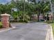 Gated entrance to the Audubon Landing community with lush landscaping and signage at 19137 Lake Audubon Dr, Tampa, FL 33647
