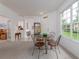 Dining room area features a window, and a view leading to other rooms within the home at 19137 Lake Audubon Dr, Tampa, FL 33647
