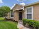 Inviting front entrance with a dark door, manicured landscaping and bright windows at 19137 Lake Audubon Dr, Tampa, FL 33647
