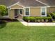 Charming home exterior with manicured lawn and welcoming front entrance at 19137 Lake Audubon Dr, Tampa, FL 33647