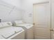 Well-organized laundry room with modern washer and dryer units at 19137 Lake Audubon Dr, Tampa, FL 33647