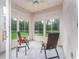Relaxing sunroom with views of the private backyard at 19137 Lake Audubon Dr, Tampa, FL 33647