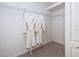 Bright walk-in closet features wire shelving and two hanging plush robes at 19137 Lake Audubon Dr, Tampa, FL 33647