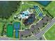 Aerial view of community amenities featuring a clubhouse, pool, tennis courts, and outdoor recreation areas at 1978 Pepper Grass Dr, North Port, FL 34289