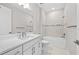 Bathroom with marble countertops, modern fixtures, and a tiled shower/tub combo at 1978 Pepper Grass Dr, North Port, FL 34289