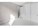 Bright bedroom with neutral tones, plush carpet, and ample closet space at 1978 Pepper Grass Dr, North Port, FL 34289
