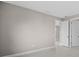 Empty room featuring neutral walls, white trim, tile flooring and 2 doors at 1978 Pepper Grass Dr, North Port, FL 34289