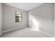 Bright bedroom with carpeted floor, white trim and a window providing natural light at 1978 Pepper Grass Dr, North Port, FL 34289
