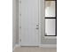 Close-up of a white front door with sidelight at 1978 Pepper Grass Dr, North Port, FL 34289