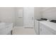 Well-equipped laundry room featuring modern washer and dryer units, storage, and a utility sink at 1978 Pepper Grass Dr, North Port, FL 34289
