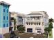 Close up of new townhome construction showing covered parking, balconies and rooftop patios at 20 Outlook Way # 10, Dunedin, FL 34698
