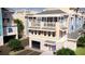 New townhome construction showing covered parking, balconies and rooftop patios at 20 Outlook Way # 10, Dunedin, FL 34698