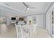 Open-concept dining area connected to the living room and kitchen at 2132 Academy Dr, Clearwater, FL 33764
