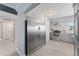 Modern kitchen featuring stainless steel appliances, updated cabinets, and a seamless transition to the living area at 2132 Academy Dr, Clearwater, FL 33764