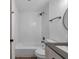 Bathroom featuring a shower over tub with white subway tile surround, updated fixtures, and modern vanity at 2353 Shelley St # 6, Clearwater, FL 33765