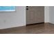 Bedroom featuring laminate flooring, baseboards and window at 2353 Shelley St # 6, Clearwater, FL 33765