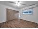 The bedroom features a ceiling fan, closet, laminate floors and a mini-split air conditioner at 2353 Shelley St # 6, Clearwater, FL 33765