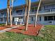 An apartment entrance featuring mailboxes and mulch landscaping, enhancing the curb appeal at 2353 Shelley St # 6, Clearwater, FL 33765