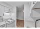 Well-lit kitchen featuring white cabinets, tile backsplash, and modern appliances at 2353 Shelley St # 6, Clearwater, FL 33765