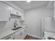 Clean kitchen featuring white cabinetry, new countertops, and a stainless steel faucet at 2353 Shelley St # 6, Clearwater, FL 33765