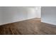 Bright and airy living room showcasing wood-look tile flooring and neutral walls at 2353 Shelley St # 6, Clearwater, FL 33765