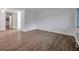 Spacious living room with stylish wood-look flooring and ample natural light at 2353 Shelley St # 6, Clearwater, FL 33765