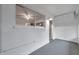 An interior room with a large window, painted concrete floors and simple aesthetic at 2353 Shelley St # 6, Clearwater, FL 33765