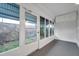 Sunroom with tiled flooring, windowed walls, and a view of the backyard at 2353 Shelley St # 6, Clearwater, FL 33765