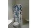 Clean bathroom features a floral shower curtain and standard fixtures at 2447 Ecuadorian Way # 11, Clearwater, FL 33763