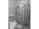 The updated bathroom has a new shower with a safety handle at 2447 Ecuadorian Way # 11, Clearwater, FL 33763