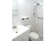 Bathroom featuring a white vanity, toilet, walk-in shower, and patterned floor tiles at 2447 Ecuadorian Way # 11, Clearwater, FL 33763