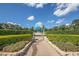 Community landmark featuring a large globe sculpture surrounded by lush landscaping and walkways at 2447 Ecuadorian Way # 11, Clearwater, FL 33763