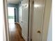 Hallway with hardwood floors and multiple closet doors at 2447 Ecuadorian Way # 11, Clearwater, FL 33763