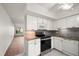 Bright kitchen featuring white appliances, granite countertops, and open floor plan at 2447 Ecuadorian Way # 11, Clearwater, FL 33763