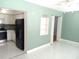 Open-concept living space connecting the kitchen and bedrooms at 2447 Ecuadorian Way # 11, Clearwater, FL 33763