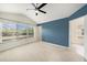 Spacious bedroom with large windows and neutral carpet and ceiling fan at 2542 Glenrise Pl, Wesley Chapel, FL 33544