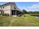 The backyard overlooks a serene pond, adding a touch of nature to the property at 2542 Glenrise Pl, Wesley Chapel, FL 33544