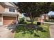 Charming townhouse featuring a well-manicured lawn and an attached single-car garage at 2542 Glenrise Pl, Wesley Chapel, FL 33544