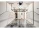 Spacious garage with overhead storage, concrete floor, and utility connections at 2542 Glenrise Pl, Wesley Chapel, FL 33544