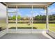 Enjoy tranquil pond views from this screened lanai, perfect for outdoor relaxation at 2542 Glenrise Pl, Wesley Chapel, FL 33544