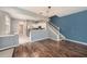 Living room with an adjacent kitchen featuring stainless steel appliances at 2542 Glenrise Pl, Wesley Chapel, FL 33544