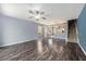 Living room with wood floors and staircase leading to the second floor at 2542 Glenrise Pl, Wesley Chapel, FL 33544