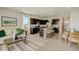 Open concept kitchen with dark cabinets, stainless steel appliances, and a large island with counter seating at 255 Royal Spoonbill Dr, Ruskin, FL 33570