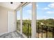 Balcony overlooking trees and a distant city skyline at 3211 W Swann Ave # 605, Tampa, FL 33609