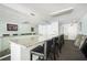 Community bar area with granite countertop and seating at 3211 W Swann Ave # 605, Tampa, FL 33609
