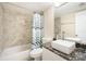 Updated bathroom with sleek vanity, stylish fixtures, and shower with patterned curtain at 3211 W Swann Ave # 605, Tampa, FL 33609
